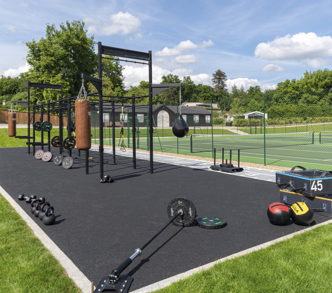 wetpour rubber, outdoor gym surfacing, wellness path surfacing, poured-in-place rubber, rubber safety surfacing, office park amenities, corporate wellness paths, outdoor fitness area flooring, ADA-compliant rubber surfacing, recycled rubber flooring, commercial rubber surfacing, shock-absorbing rubber surface, slip-resistant outdoor flooring, corporate outdoor gym design, seamless rubber pathway, sustainable rubber surfacing